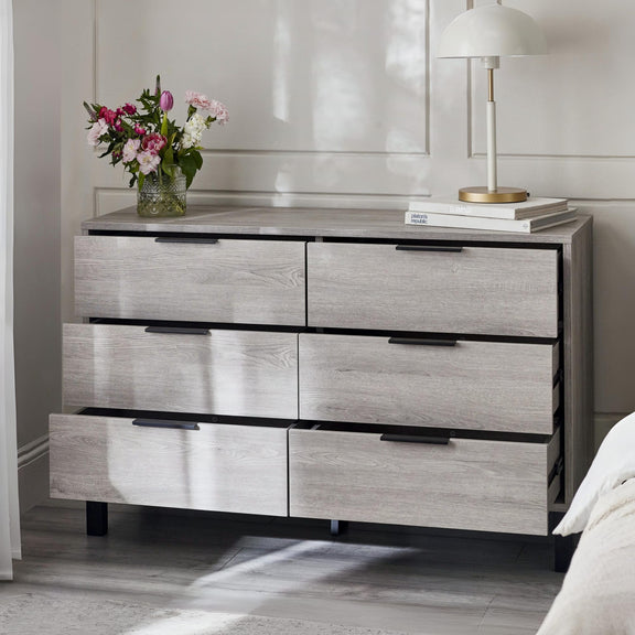 Modern dresser with marble top in a room setting