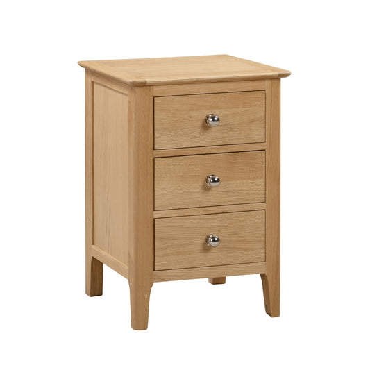 Wooden nightstand with three drawers on a white background