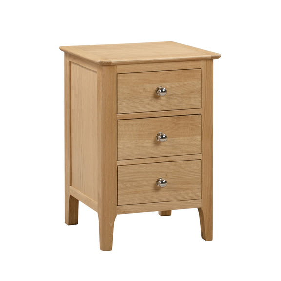 Wooden nightstand with three drawers on a white background
