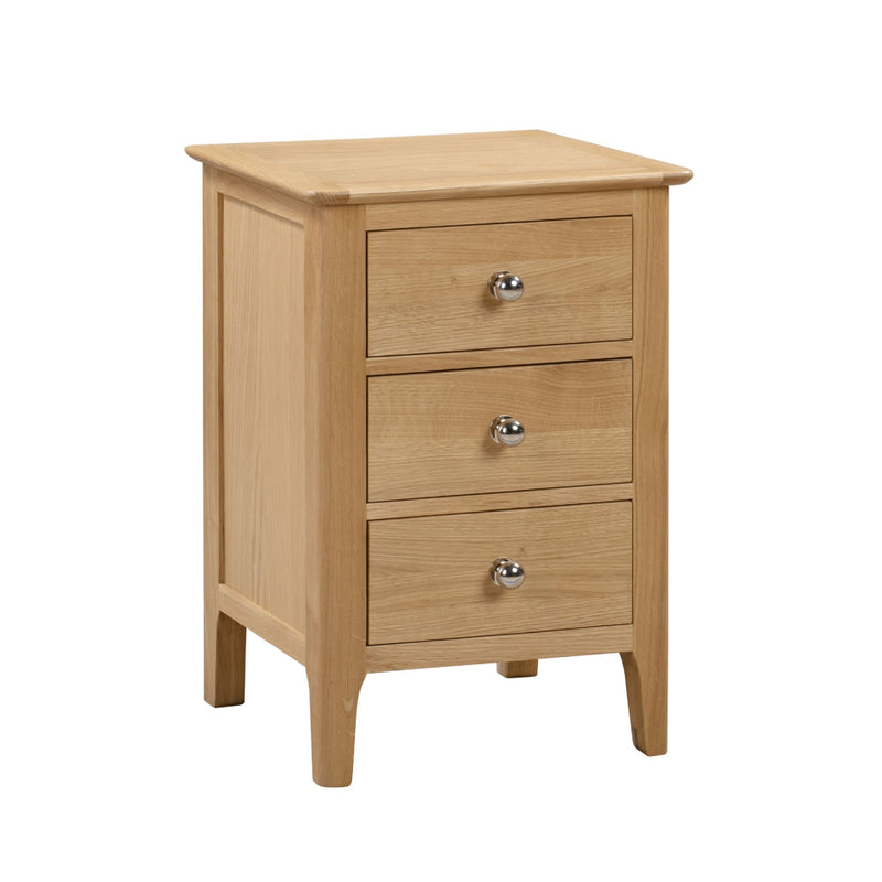 Wooden nightstand with three drawers on a white background
