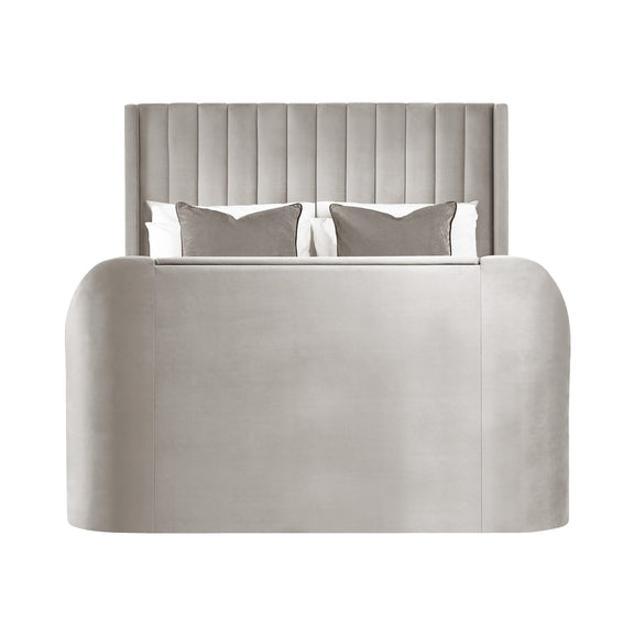 Gray upholstered bed with tufted headboard and white bedding on a white background