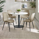 Dining room with a round table and four beige chairs on a textured rug.