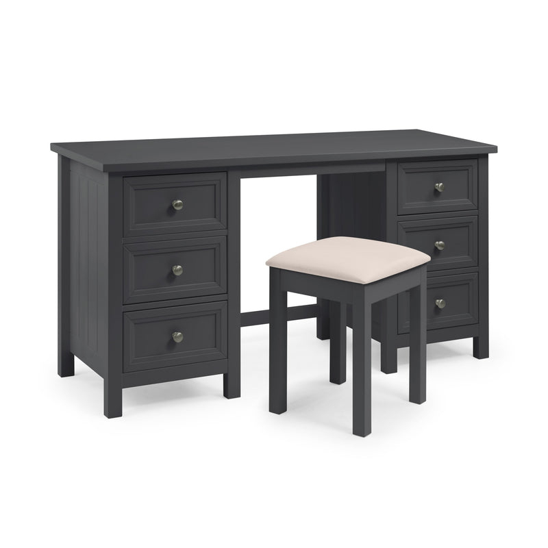 Dark wood desk with multiple drawers and a matching stool on a white background