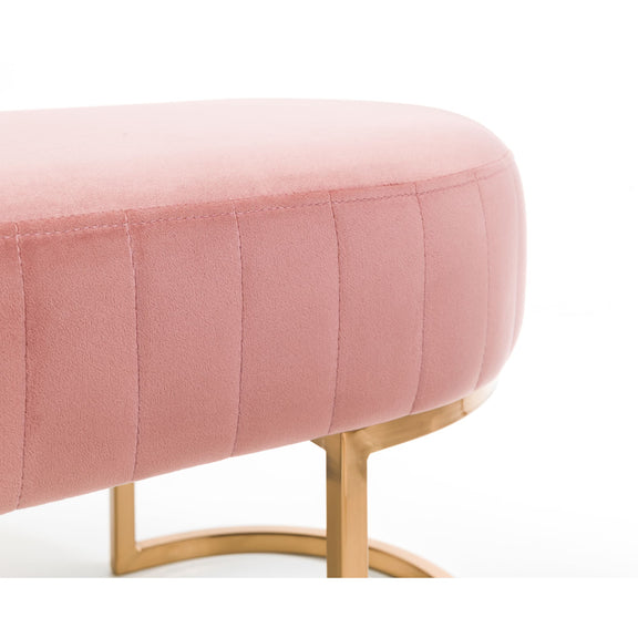 Pink ottoman with gold legs on a white background