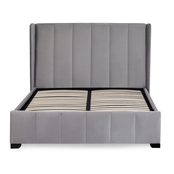 Gray upholstered bed with tufted headboard on a white background