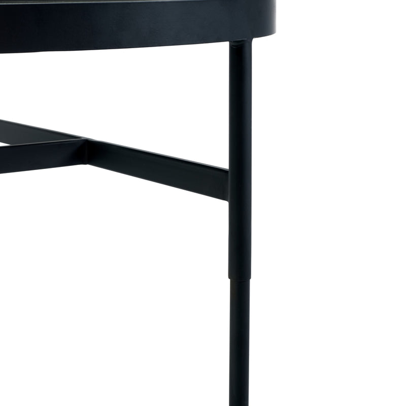 Close-up of a black metal table leg on a white background
