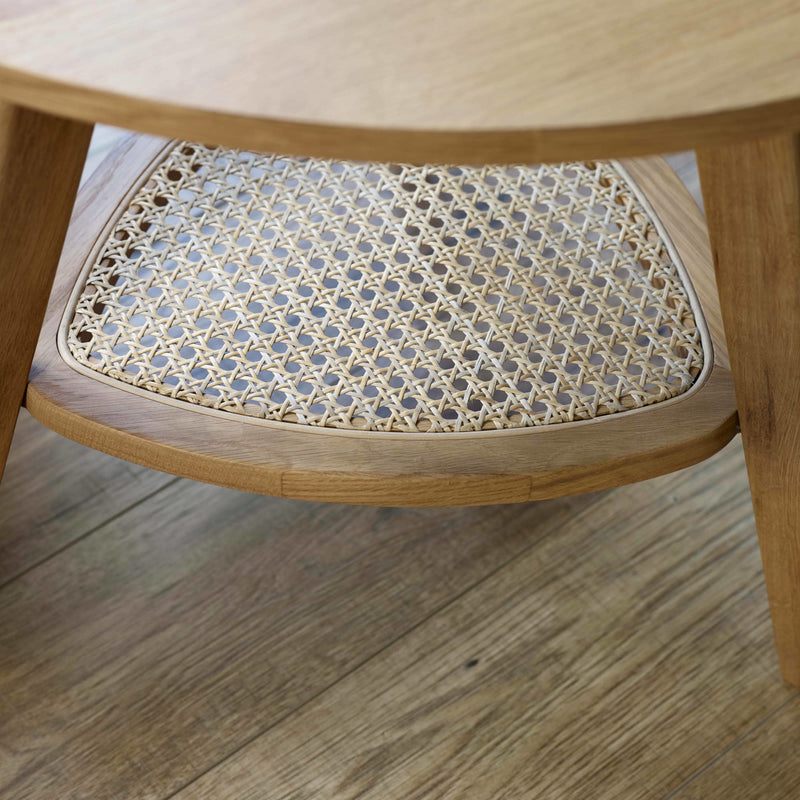 Wooden chair with a woven seat on a wooden floor