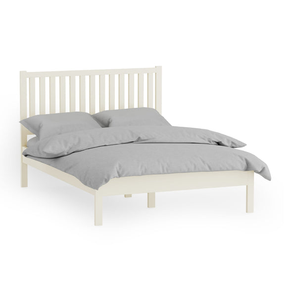 White bed frame with gray bedding on a white background