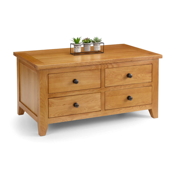 Wooden dresser with four drawers on a white background