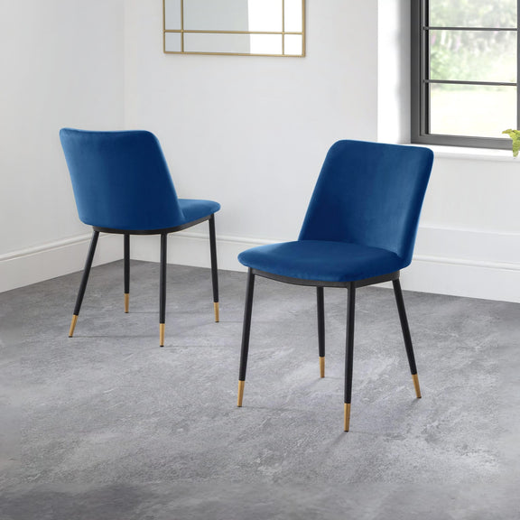 Two blue chairs with black legs on a gray floor.