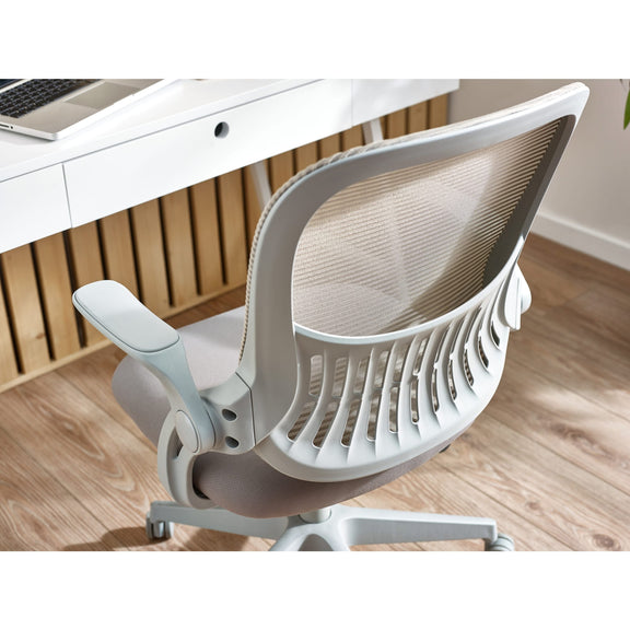White office chair in front of a desk with a laptop