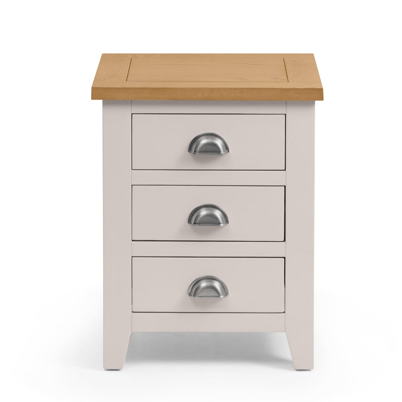 White nightstand with three drawers and a wooden top on a white background