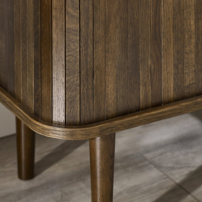 Close-up of a wooden side table with a textured surface
