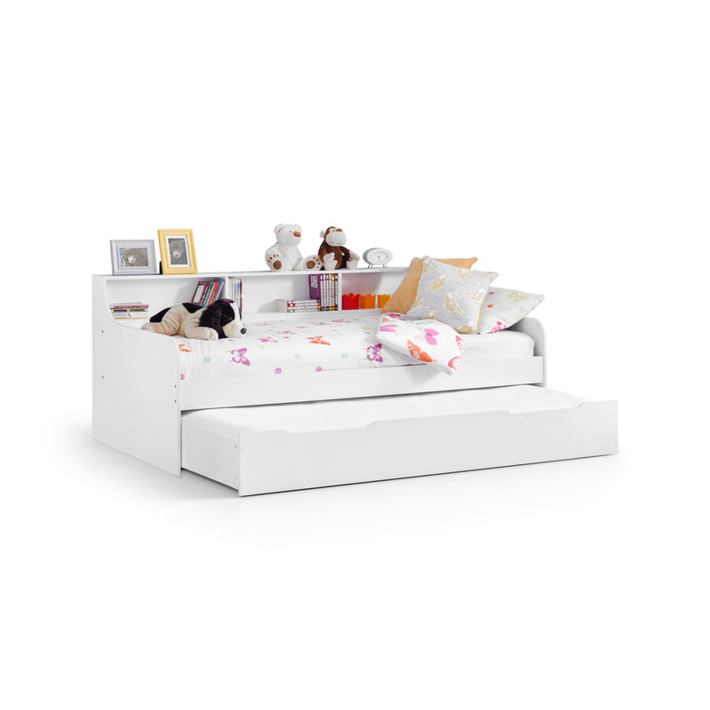White children's bed with storage drawers and toys on a white background
