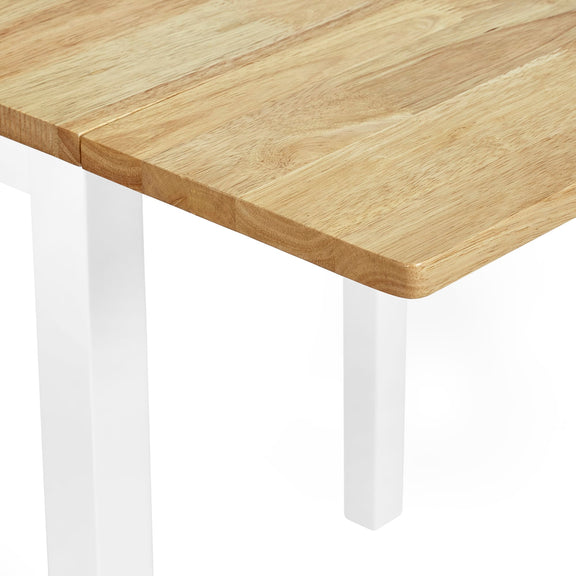 Wooden table with white legs on a white background