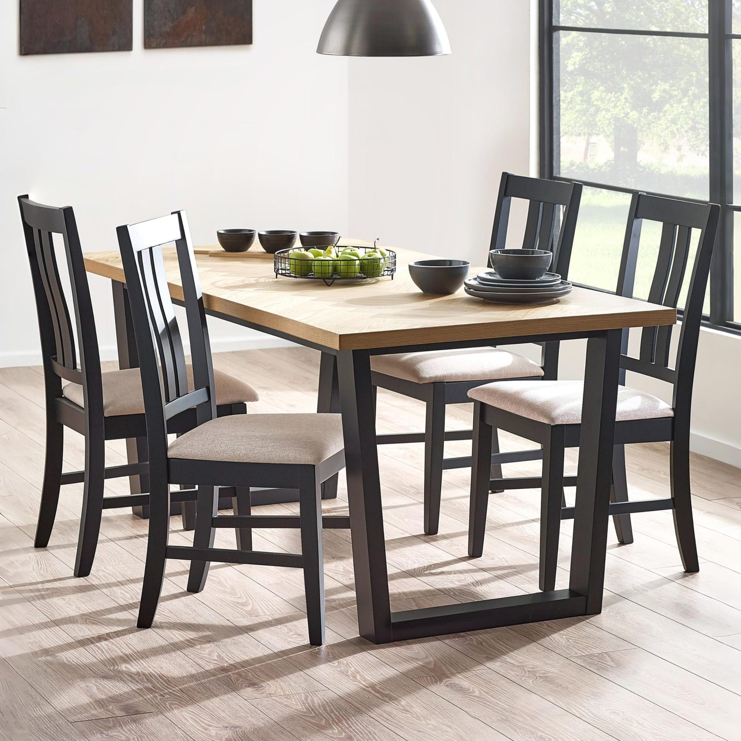 Dining table set with chairs in a well-lit room