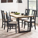 Dining table set with chairs in a well-lit room