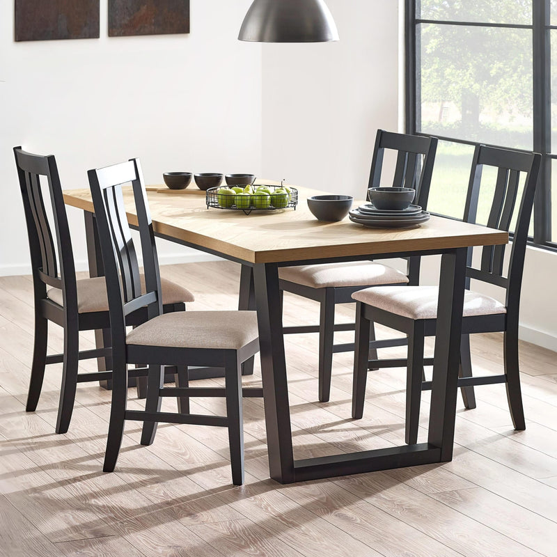 Dining table set with chairs in a well-lit room