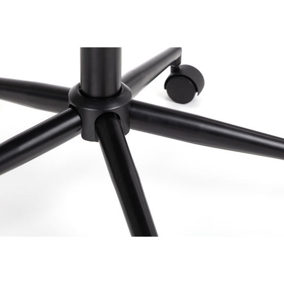 Close-up of a black metal chair base on a white background