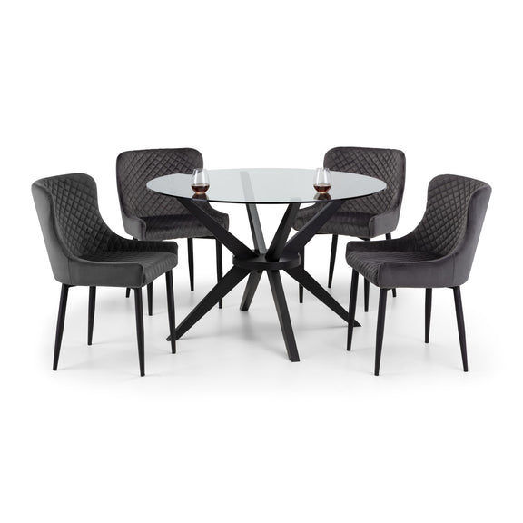 Dining table set with four chairs on a white background