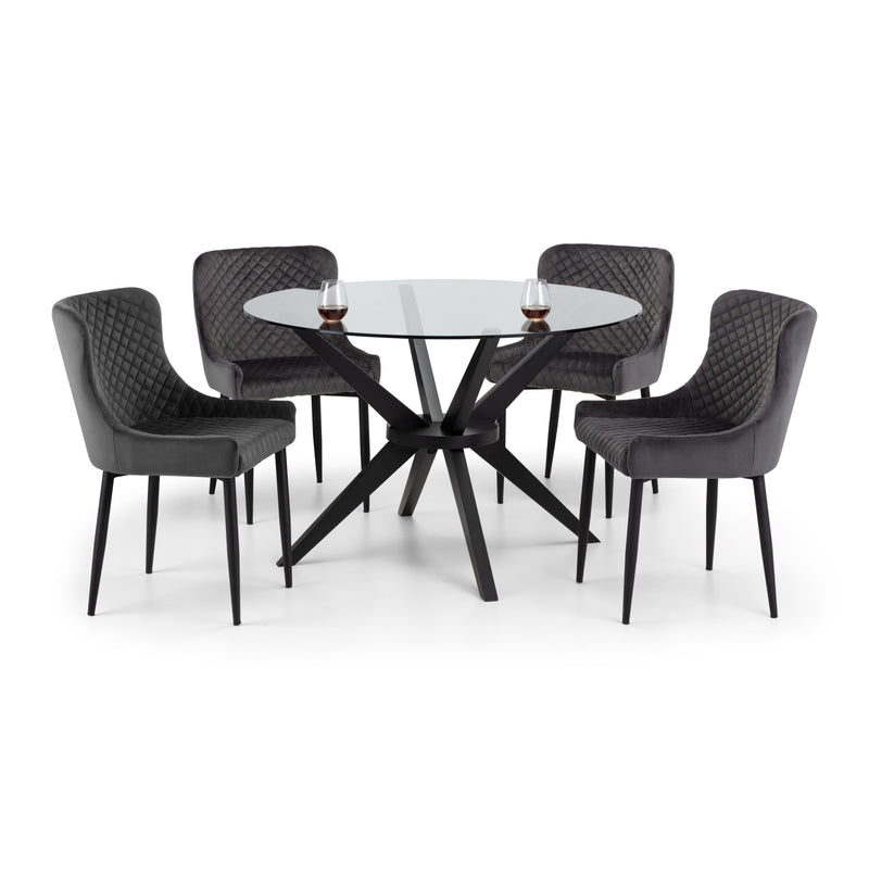 Dining table set with four chairs on a white background