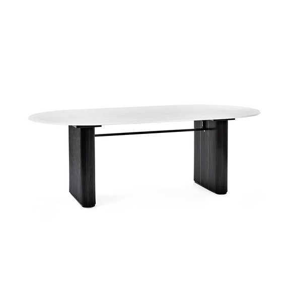 Modern dining table with white top and black legs on a white background
