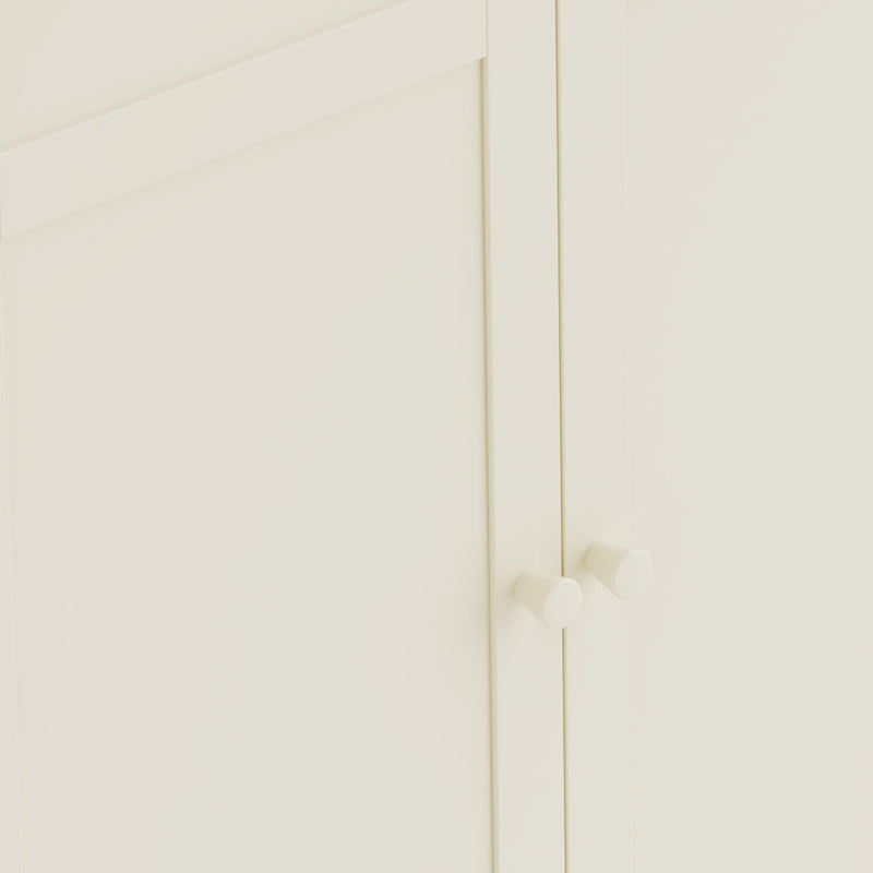 Close-up of a white cabinet with gold handles on a white background