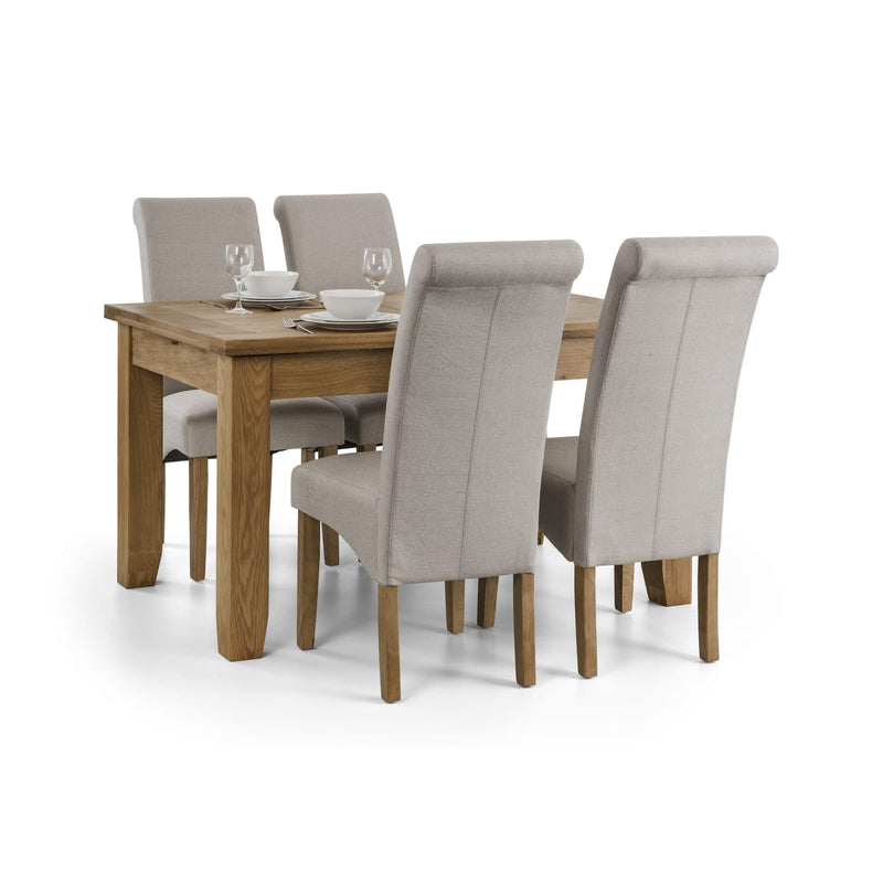 Dining table set with four chairs on a white background