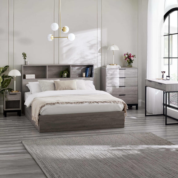 Modern bedroom with gray bed, nightstands, and dresser.