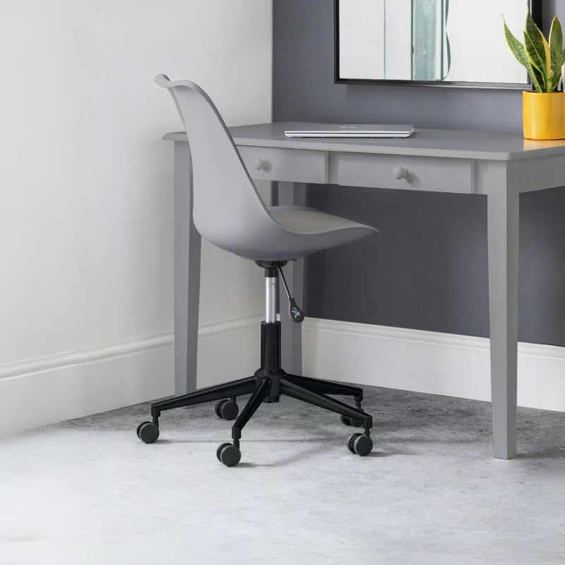 Gray office desk with a chair in a room with a plant and mirror.