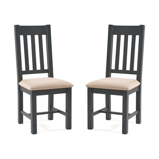 Two black chairs with beige cushions on a white background