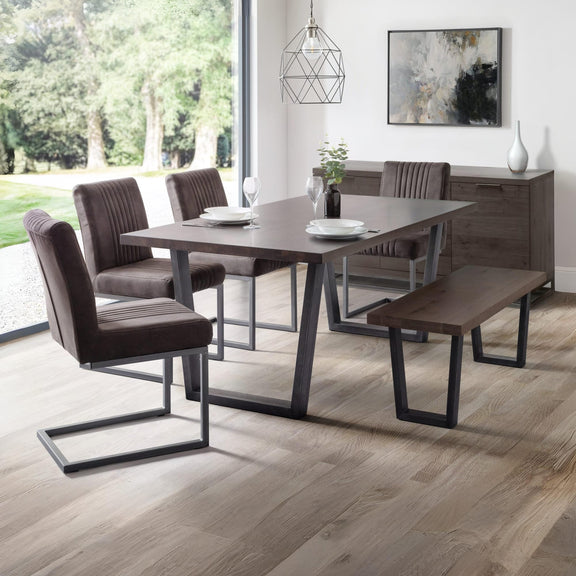 Dining room with a wooden table and chairs in a modern interior setting.