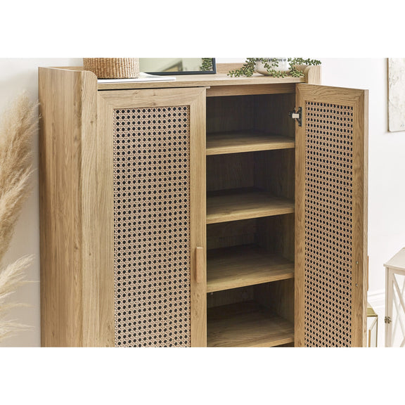 Wooden cabinet with wicker doors in a room setting
