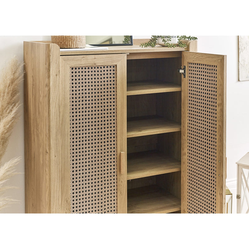 Wooden cabinet with wicker doors in a room setting
