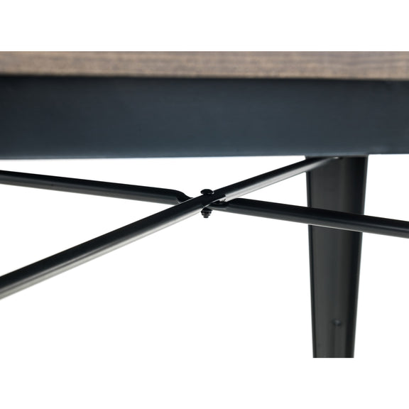 Close-up of a metal table base with a wooden top on a white background