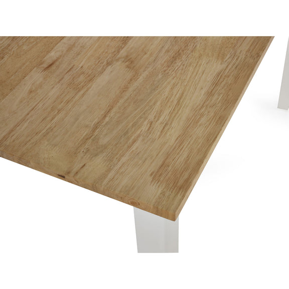 Wooden table top with white legs on a white background