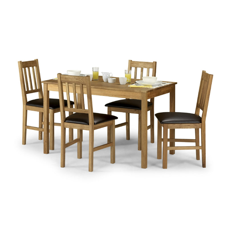 Wooden dining table set with four chairs on a white background
