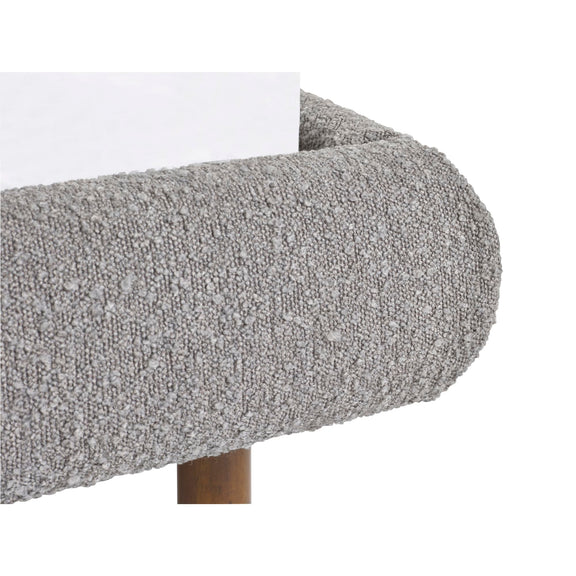 Close-up of a textured gray surface with a white edge on a white background