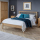 Bedroom with wooden bed, nightstands, and a wardrobe.