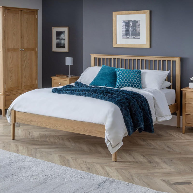 Bedroom with wooden bed, nightstands, and a wardrobe.