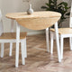 Wooden dining table with chairs on a wooden floor