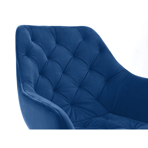 Blue tufted chair on a white background