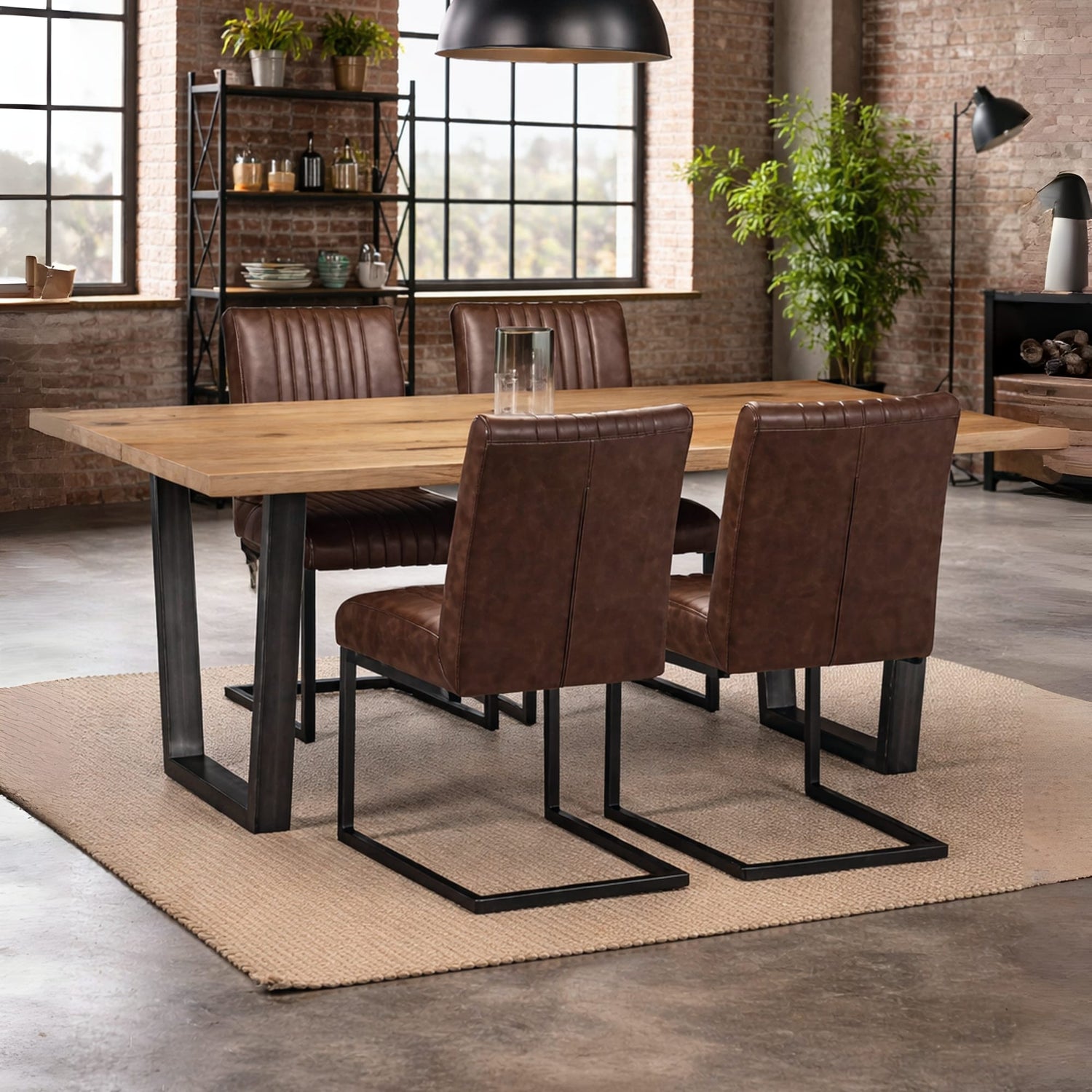 Dining area with wooden table and brown leather chairs in a modern interior setting.