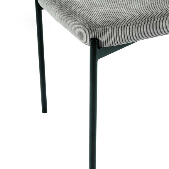 Gray upholstered chair with black metal legs on a white background