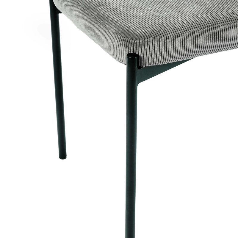 Gray upholstered chair with black metal legs on a white background