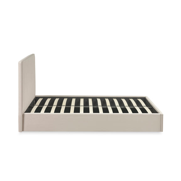 Beige bed frame with striped mattress on a white background