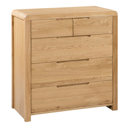 Wooden dresser with four drawers on a white background