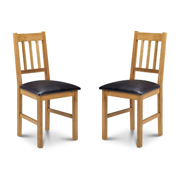Two wooden chairs with black cushioned seats on a white background