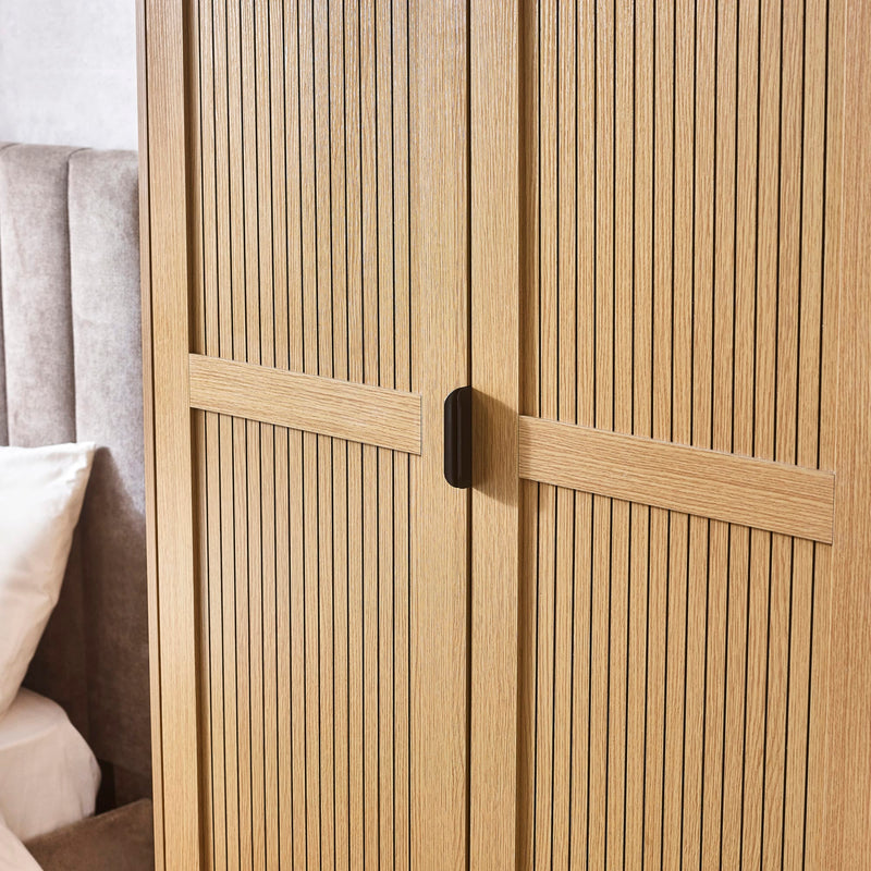 Wooden wardrobe with slatted design in a bedroom setting