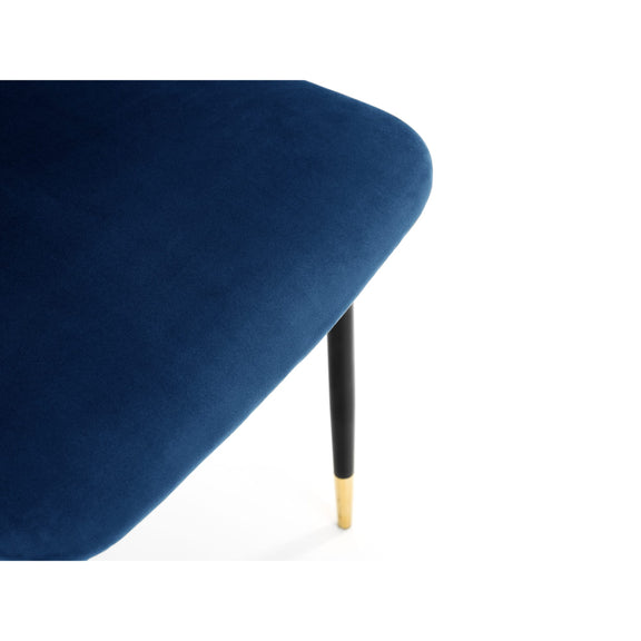 Navy blue chair with a gold leg on a white background